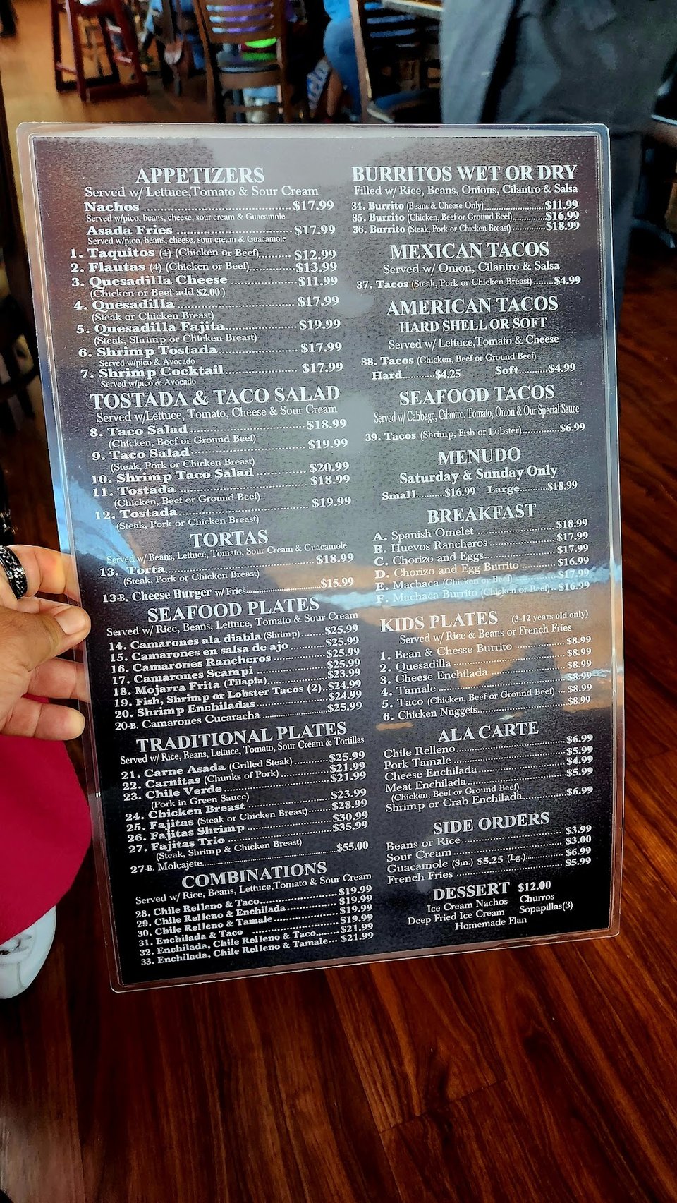 Menu layout listing burritos, chilaquiles, and pozole.